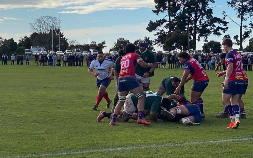 The Cook Islands launch another assault on the Tasman goal-line.