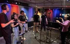 The Sitting Room Singers singing on RNZ's Nine to Noon programme.