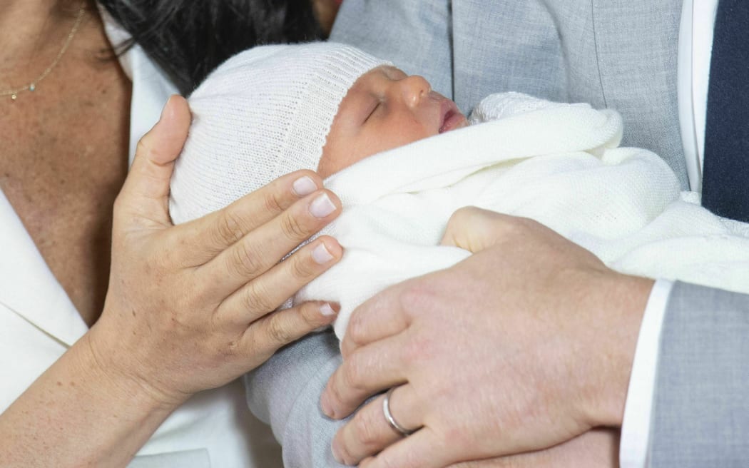 Britain's Prince Harry and Meghan, Duchess of Sussex, during a photocall with their newborn son, in St George's Hall at Windsor Castle, Windsor, south England, Wednesday May 8, 2019.