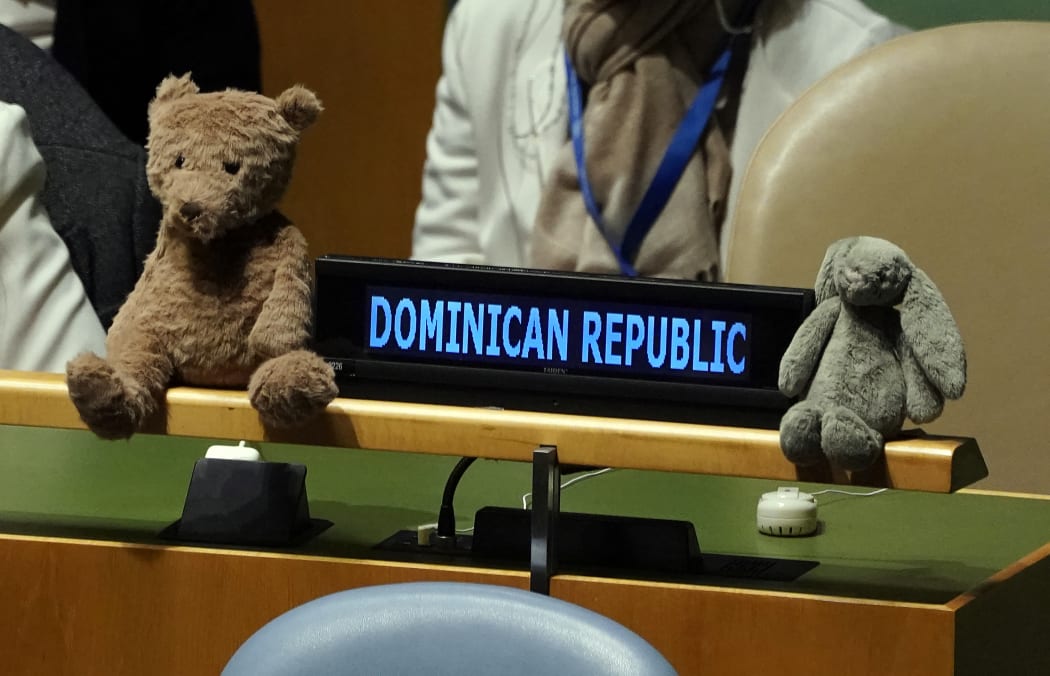 Delegates place stuffed animals on their desk during the UN General Assembly Emergency session as a symbol of the vote on the Russian resolution relating to the well-being of future generations.
