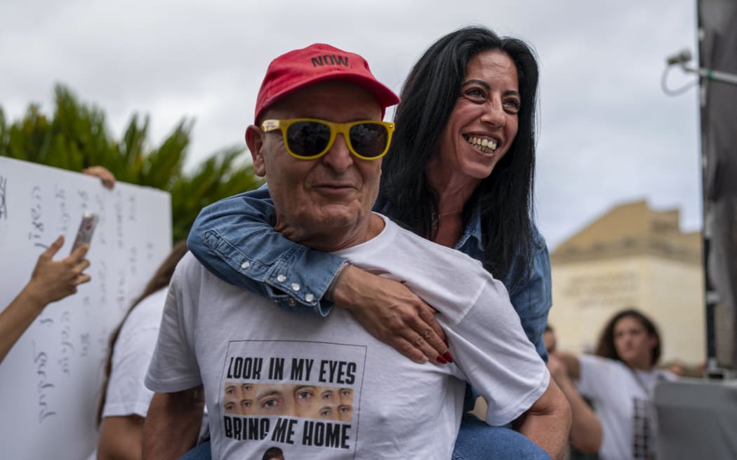 Einav Zanzauker, mother of hostage Matan Zanzauker, reacts to the hostage deal declared by the US President at Hostage Square in Tel Aviv.