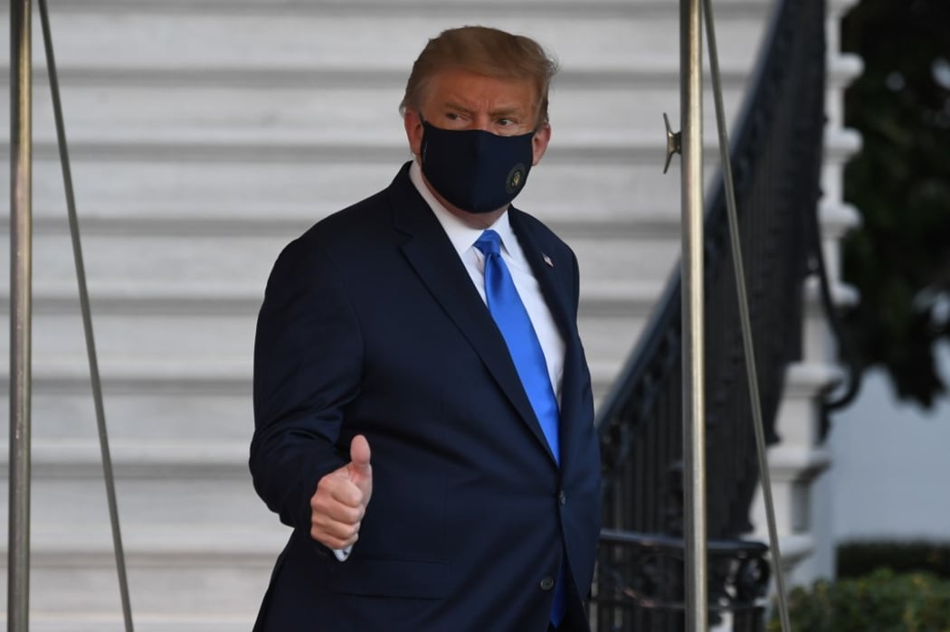 US President Donald Trump walks to Marine One prior to departure from the South Lawn of the White House in Washington, DC, October 2, 2020, as he heads to Walter Reed Military Medical Center, after testing positive for Covid-19.