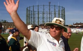 Shane Warne waves to the crowds after Australia defeated England on the final day of the fifth Test Match at the Oval August 2001.