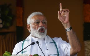 Indian Prime Minister Narendra Modi gestures during a National Democratic Alliance (NDA) rally in Chennai