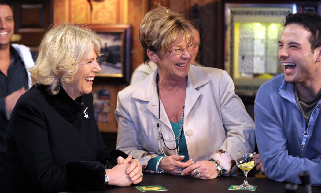 Camilla, The Duchess of Cornwall, left, with Anne Kirkbride, centre, who played  Deirdre Barlow, and Ryan Thomas, who plays the role of Jason Grimshaw.