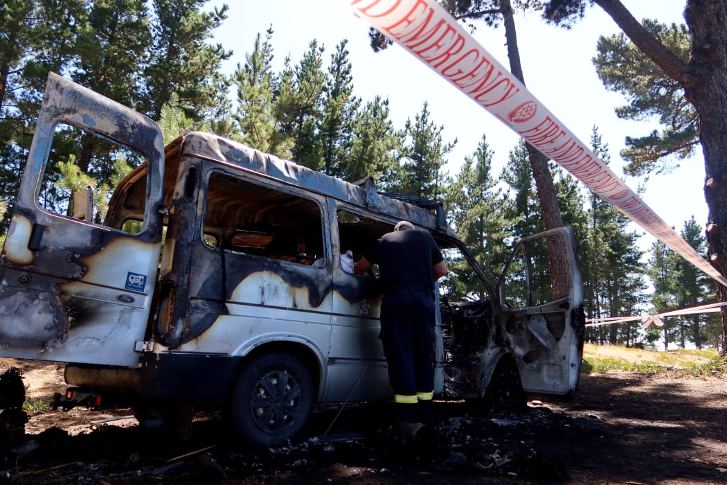 Firefighters investigate the cause of the fire on Tuesday morning.