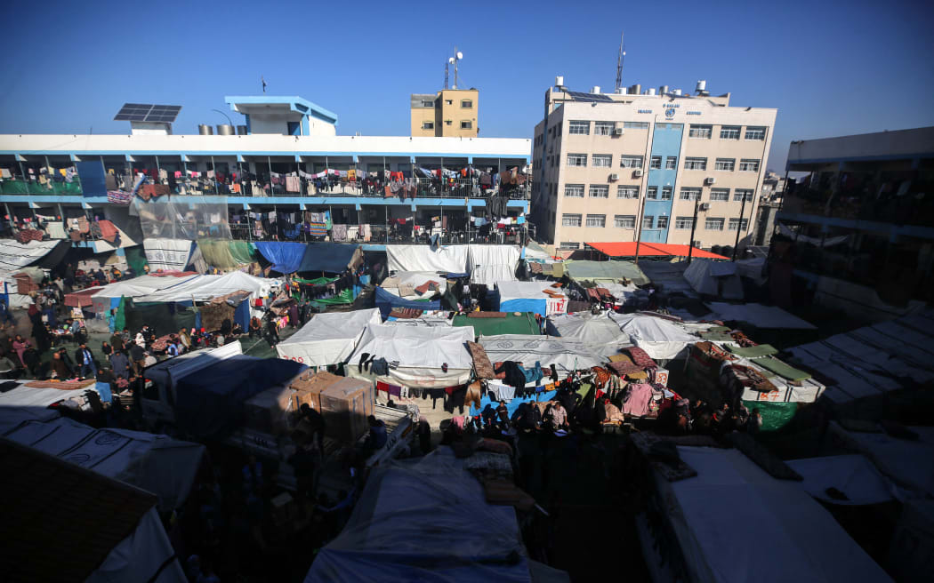 Displaced Palestinians are taking shelter in a UNRWA-affiliated Deir al-Balah school after fleeing their homes due to Israeli strikes, amid the ongoing conflict between Israel and the Palestinian Islamist group Hamas, in Deir al-Balah, in the central Gaza Strip, on December 19, 2023.