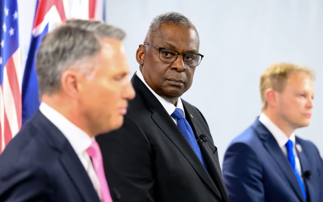 US Defense Secretary Lloyd Austin (C) listens, flanked by British Defense Secretary Grant Shapps (R) and Australian Deputy Prime Minister and Defense Minister Richard Marles, during a joint press conference during the AUKUS Defense Ministerial Meeting in Mountain View, California, on December 1, 2023.