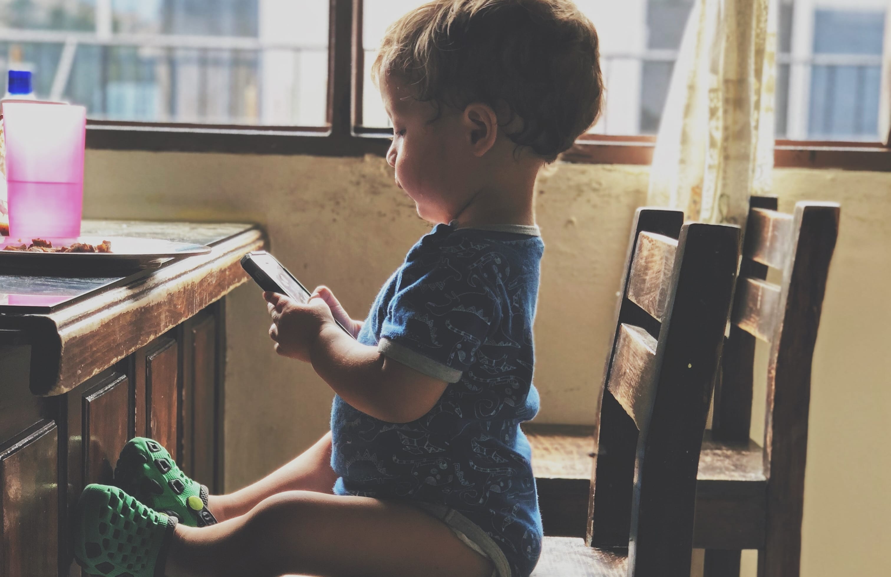 small boy on phone