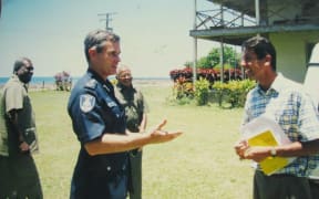 Andrew Hughes (left) in his role as Fiji Police Commissioner visits Cawaci where he meets Mr. Darren Koch (right) a fellow Australian who taught in Cawaci.