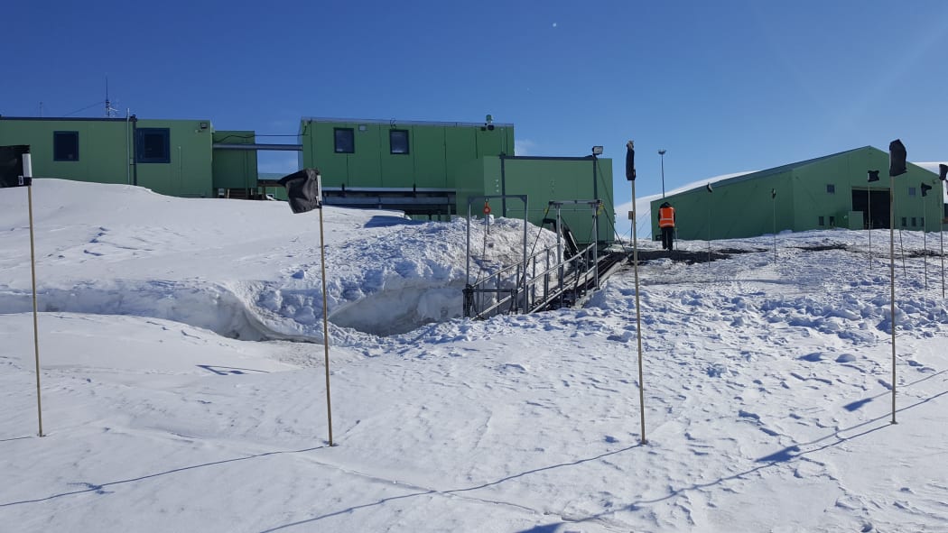 Black flags mark no-go areas on the shoreline in front of Scott Base, where the sea ice butts up against the land.