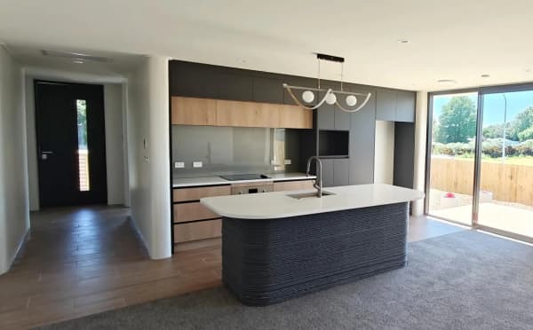 An interior shot of a modern-looking empty kitchen.