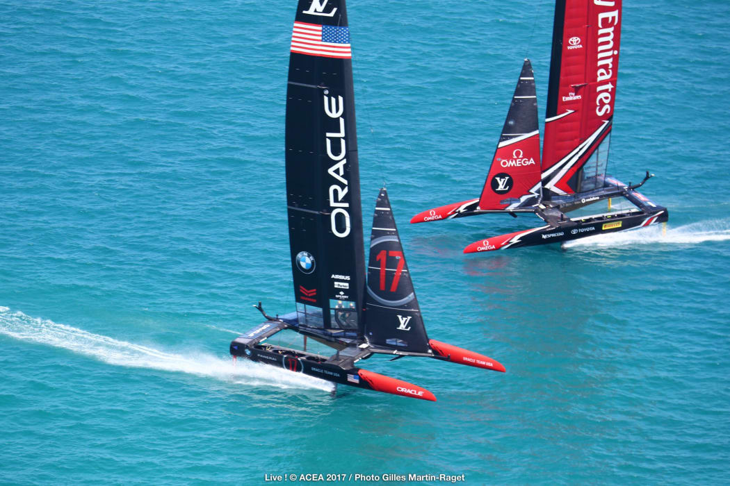 Team New Zealand and Oracle during racing on the second day of the America's cup final racing.