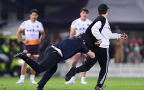 Pitch invaders during the NRL round 13 match between the New Zealand Warriors and the Brisbane Broncos at McLean Park in Napier, New Zealand on Saturday May 27, 2023. Copyright photo: Aaron Gillions / www.photosport.nz