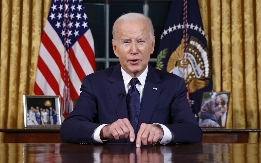 US President Joe Biden addresses the nation on the conflict between Israel and Gaza and the Russian invasion of Ukraine from the Oval Office of the White House in Washington, DC, on October 19, 2023. President Joe Biden will deliver a rare Oval Office speech October 19, 2023 urging Americans to back military aid for Israel and Ukraine at what he calls a perilous moment for democracy around the globe. (Photo by JONATHAN ERNST / POOL / AFP)