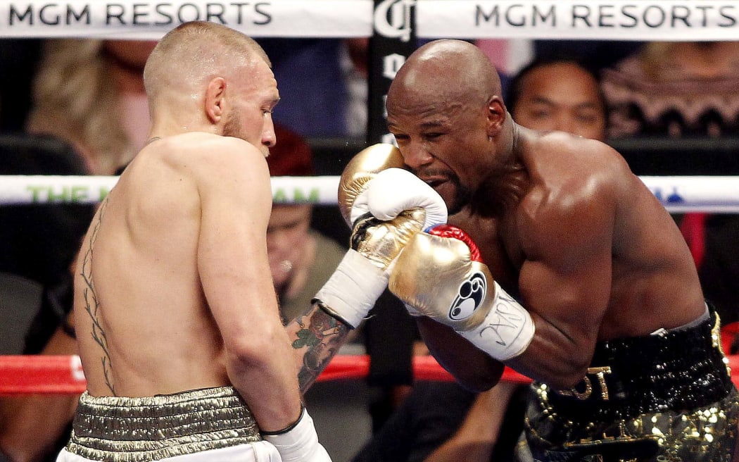 Conor McGregor and Floyd Mayweather slug it out in Las Vegas.