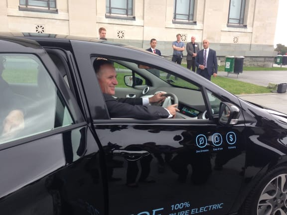 The prime minister test drives an electric car.