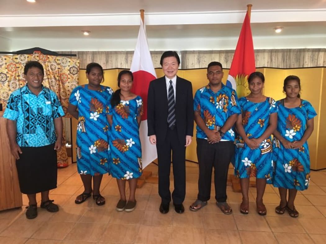 Japanese ambassador to Kiribati Masahiro Omura with a teacher and students from Tarawa who will attend a tsunami summit in Japan this week.