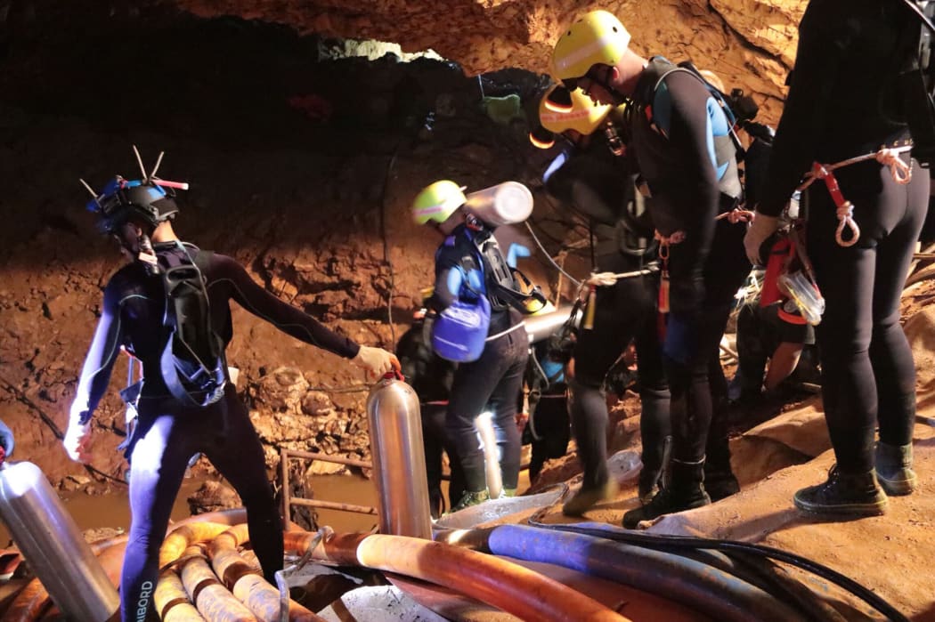 Photo taken recently by the Royal Thai Navy on 7 July, 2018 shows a group of Thai Navy divers in Tham Luang cave during rescue operations for the 12 boys and their football team coach trapped in the cave.