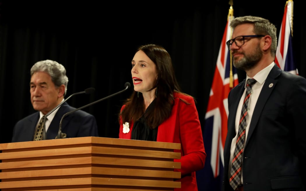 Prime Minister Jacinda Ardern - flanked by deputy PM Winston Peters and Immigration Minister Iain Lees-Galloway - announces the increase in NZ's refugee quota.