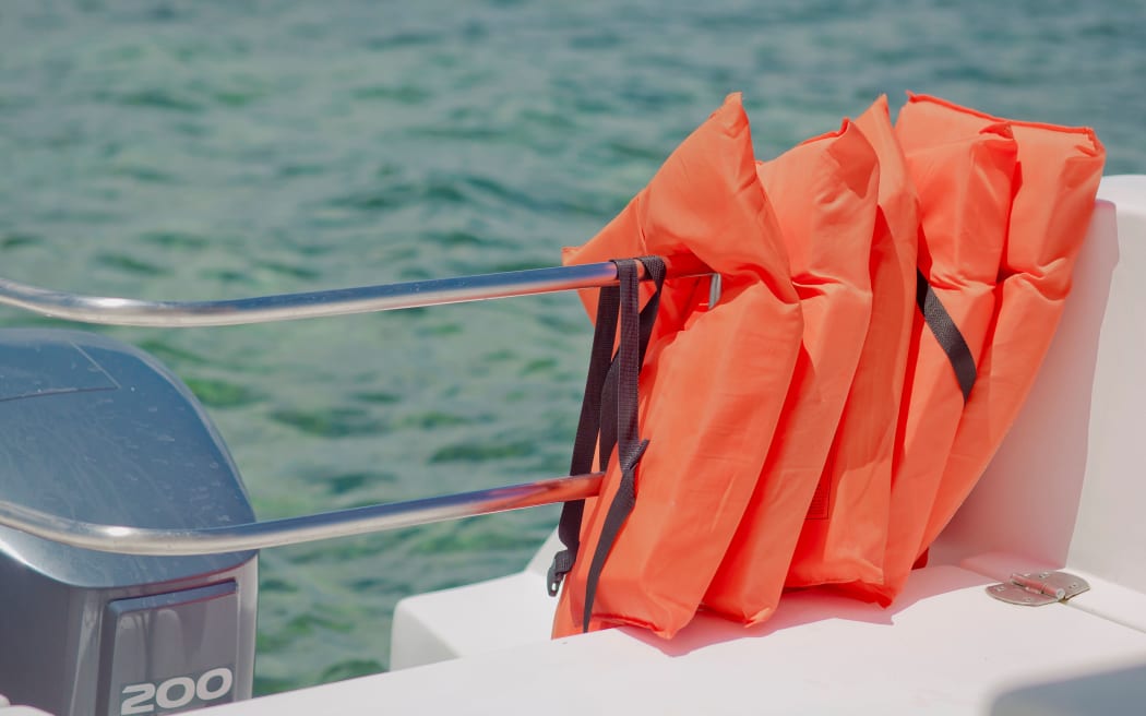 Life-jackets in speed boat against the sea. Clouse up