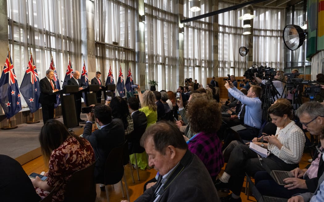 Coalition agreement signing ceremony between Christopher Luxon, David Seymour and Winston Peters.