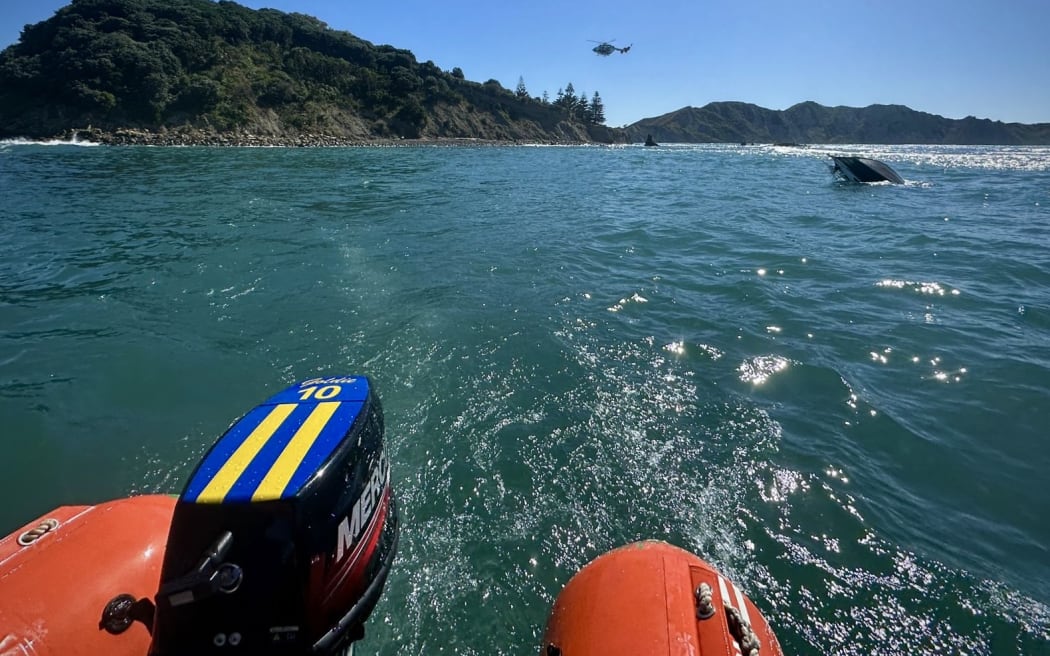 Eastland Rescue Helicopter and search and rescue were called to Tuamotu Island just off Gisborne's Sponge Bay at 9.20am on Tuesday after a small boat capsized, leaving three people in the water about 100 metres off shore.
