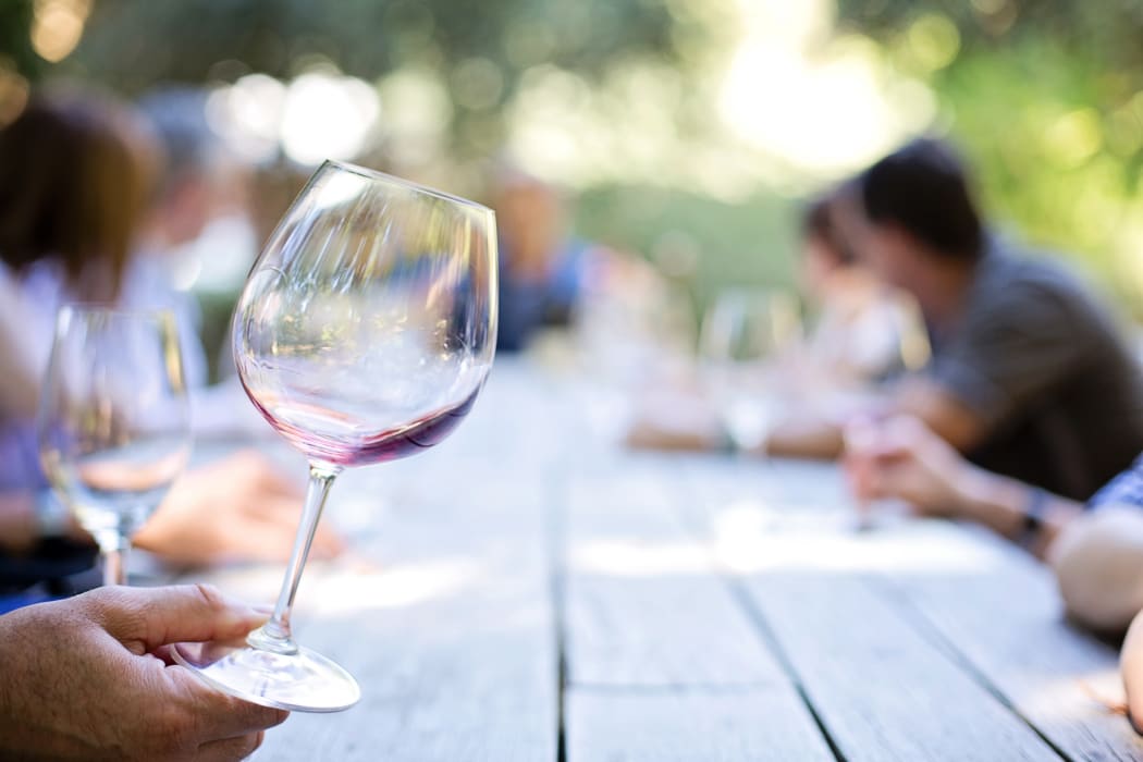 man holding wine glass