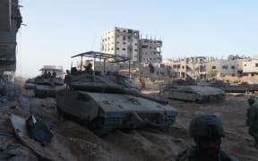 Israeli troops are pictured during operations in northern Gaza on 8 November  2023, amid continuing battles between Israel and the Palestinian militant group Hamas.