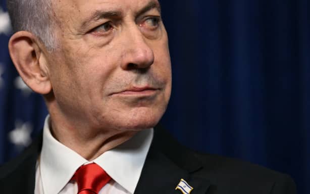 Israeli Prime Minister Benjamin Netanyahu looks on as US President Donald Trump (off frame) speaks during a joint press conference at Trump’s Mar-a-Lago residence in Palm Beach, Florida, on December 29, 2025. US President Donald Trump hosted Israeli Prime Minister Benjamin Netanyahu in Florida on December 29 for crucial talks on moving to the next stage of the fragile Gaza truce plan.
The two leaders also discussed Iran, with Trump saying that if Tehran rebuilt its nuclear facilities the United States would "knock them down." (Photo by Jim WATSON / AFP)