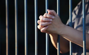 female hands in jail