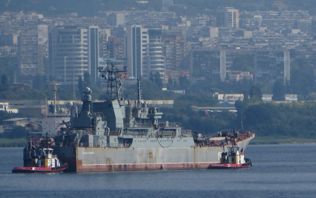 Russian Landing Ship Caesar Kunikov supported by tug boats floats at the Black sea gulf of Varna east of the Bulgarian capital Sofia, Friday, Aug. 2014. The ship was in Bulgaria for planed repair at the (Photo by Impact Press Group / NurPhoto / NurPhoto via AFP)