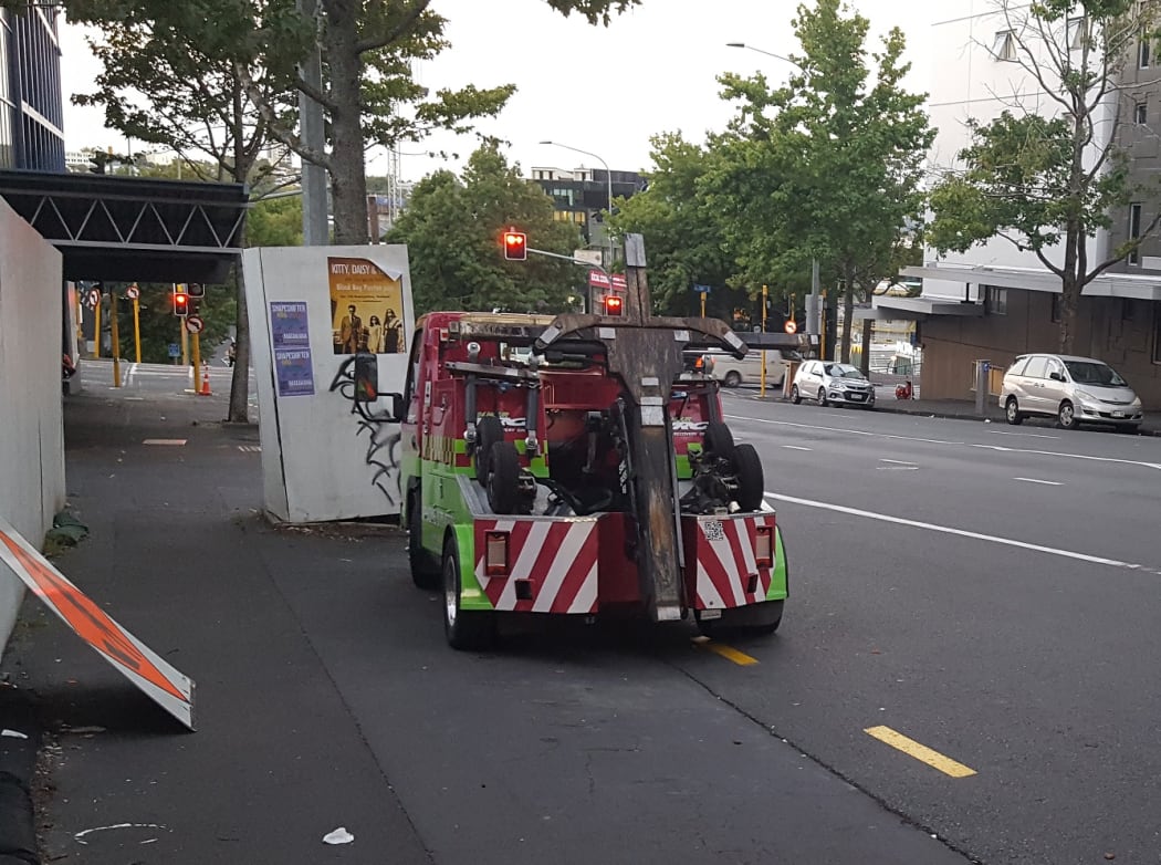The two truck parked illegally on Cook St in central Auckland for about half an hour.