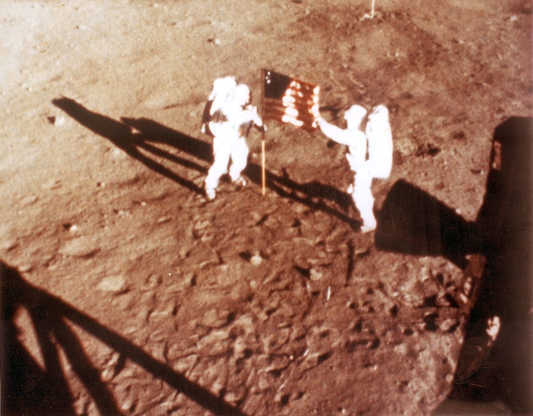 Neil Armstrong and 'Buzz' Aldrin plant the US flag on the lunar surface on 20 July 1969