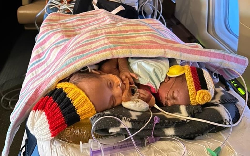 The twins en route to Sydney in an incubator