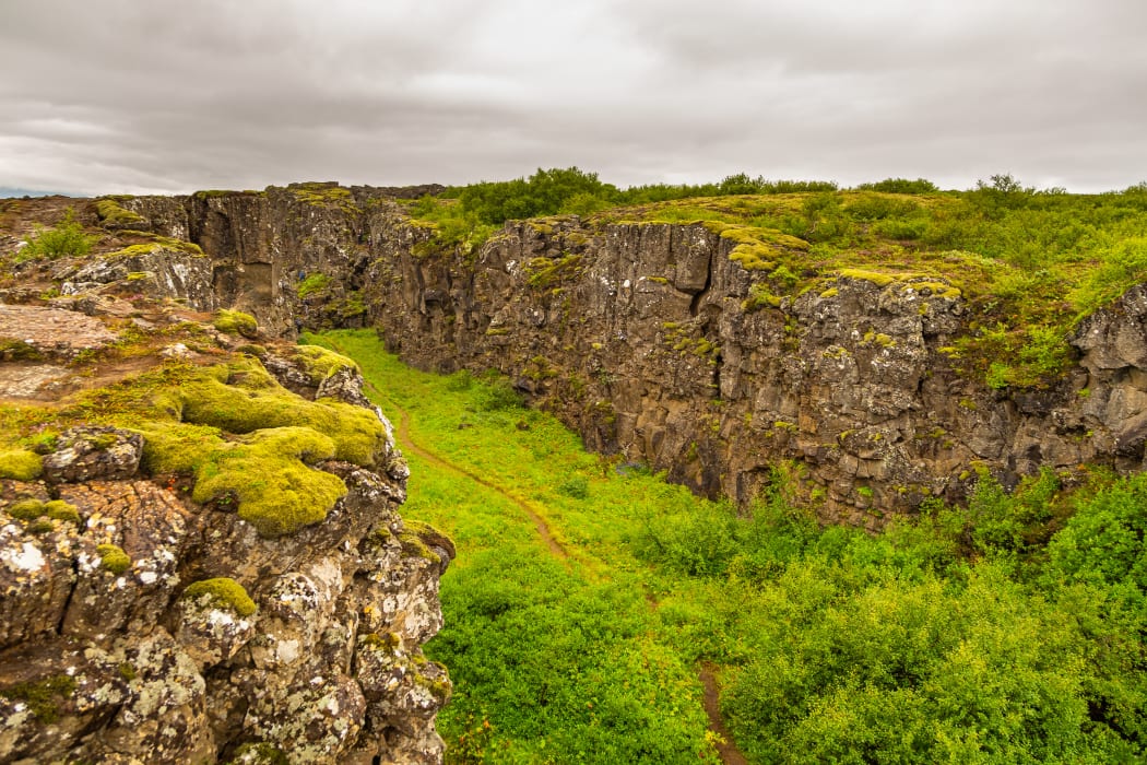 The rift valley in Iceland marks the crest of the Mid-Atlantic Ridge and the boundary between the North American and Eurasian tectonic plates.