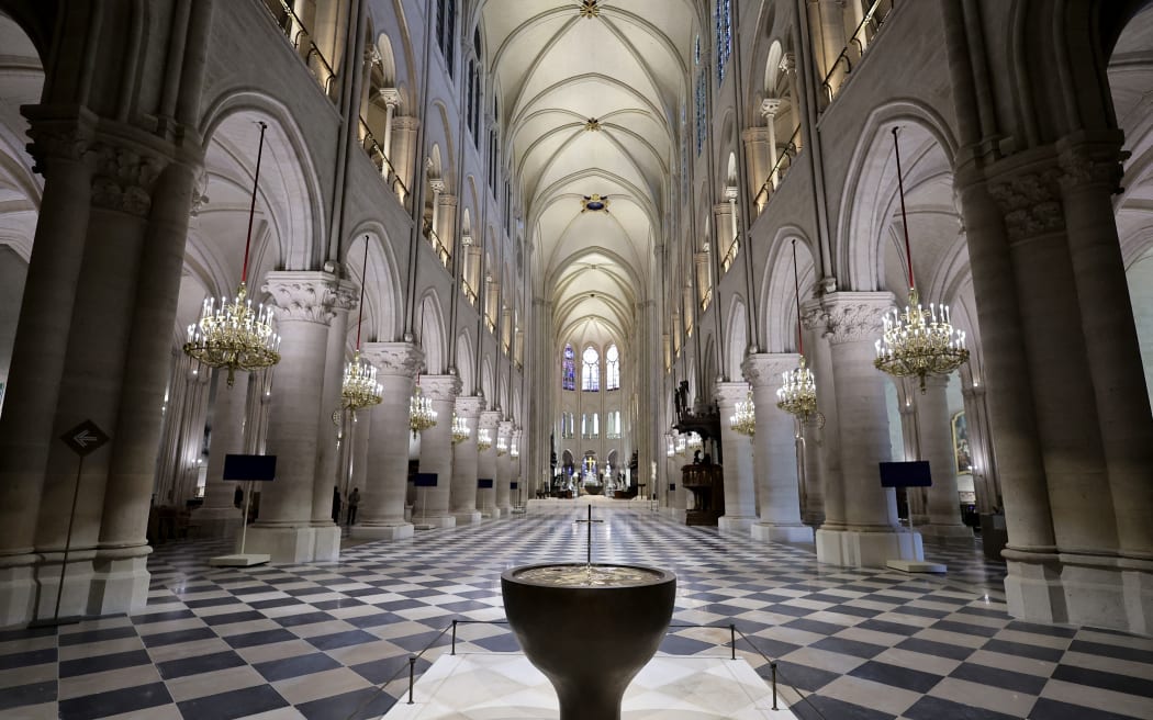 This photograph shows the baptistery of Notre-Dame de Paris cathedral, designed by French artist and designer Guillaume Bardet, in Paris on November 29, 2024. - The Notre-Dame Cathedral is set to re-open early December 2024, with a planned weekend of ceremonies on December 7 and 8, 2024, five years after the 2019 fire which ravaged the world heritage landmark and toppled its spire. (Photo by Christophe PETIT TESSON / POOL / AFP) / RESTRICTED TO EDITORIAL USE - MANDATORY MENTION OF THE ARTIST UPON PUBLICATION - TO ILLUSTRATE THE EVENT AS SPECIFIED IN THE CAPTION