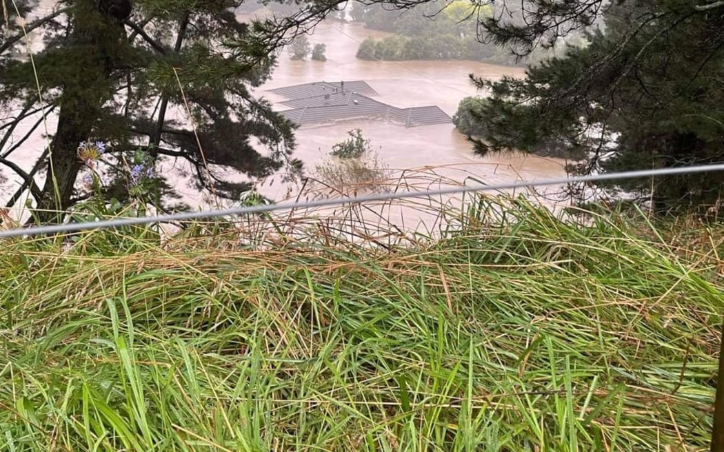 Home flooded up to its roof in Rissington, Hawke's Bay.