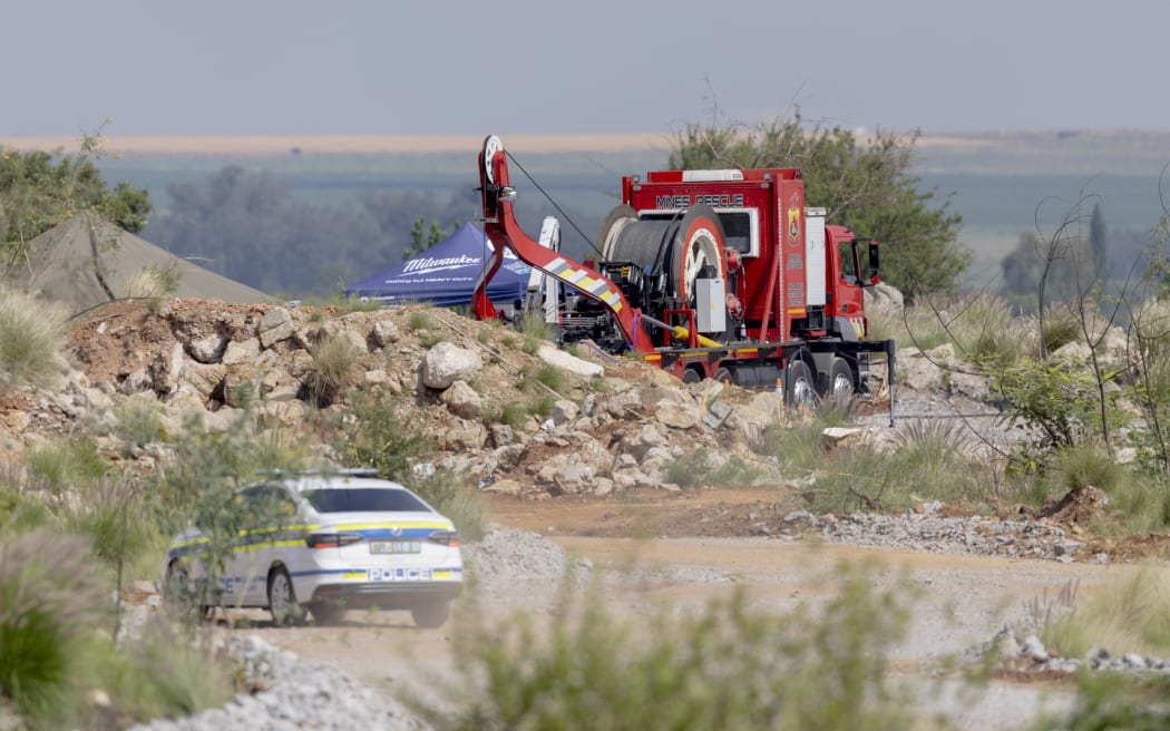 Rescuers use a Metalliferous Mobile Rescue Winder during a rescue operation to retrieve illegal miners from an abandoned gold shaft in Stilfontein on January 13, 2025. Rescuers hoisted seven illegal miners and at least four bodies out of an abandoned gold mine in South Africa on January 13, 2025 amid claims that hundreds more may be underground as well as many corpses.
A professional mine rescue company sent a large cage down into the shaft, launching an official operation to retrieve men at the site near Stilfontein, about 140 kilometres (90 miles) southwest of Johannesburg. (Photo by Christian Velcich / AFP)