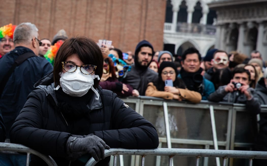 A woman wearing protective mask at the Venice Carnival, Italy, on 23 February 2020 due to concerns over coronavirus infection.