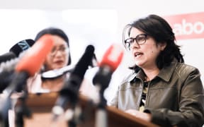Ayesha Verrall  (at podium)