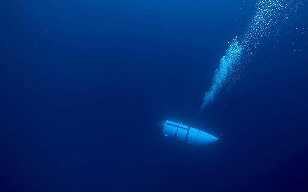 This undated image courtesy of OceanGate Expeditions, shows their Titan submersible during a descent. A Titan deep-diving tourist submersible imploded near the wreck of the Titanic, killing all five people inside, in June 2023.