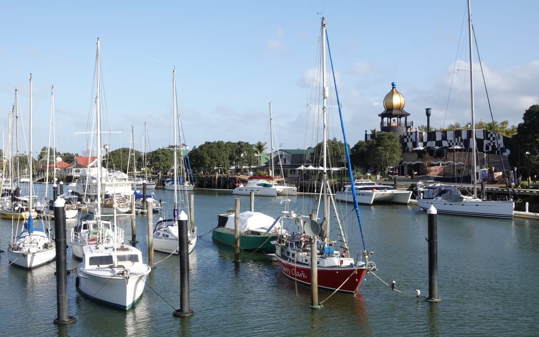 Yachts moored at Whangārei Town Basin with the Hundertwasser Arts Centre in the background