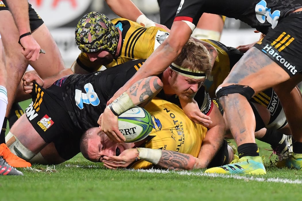Hurricanes TJ Perenara scores a try.