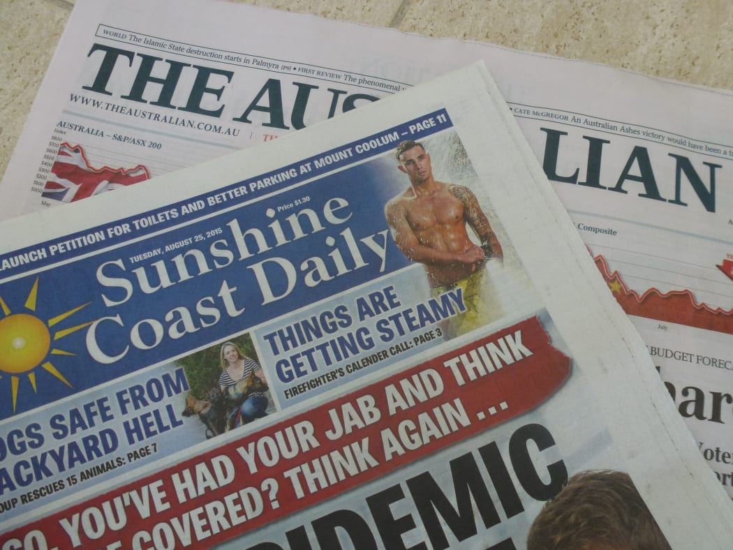 newspapers - Sunshine Coast Daily hiding a copy of the Australian