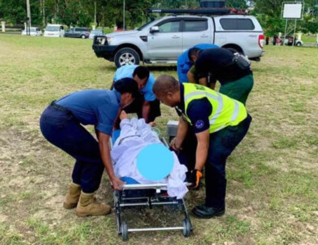 Fiji Navy and Health Ministry personnel help evacuate the New Zealand man to a hospital.