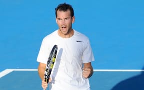 Adrian Mannarino celebrates his win over Lucas Pouille