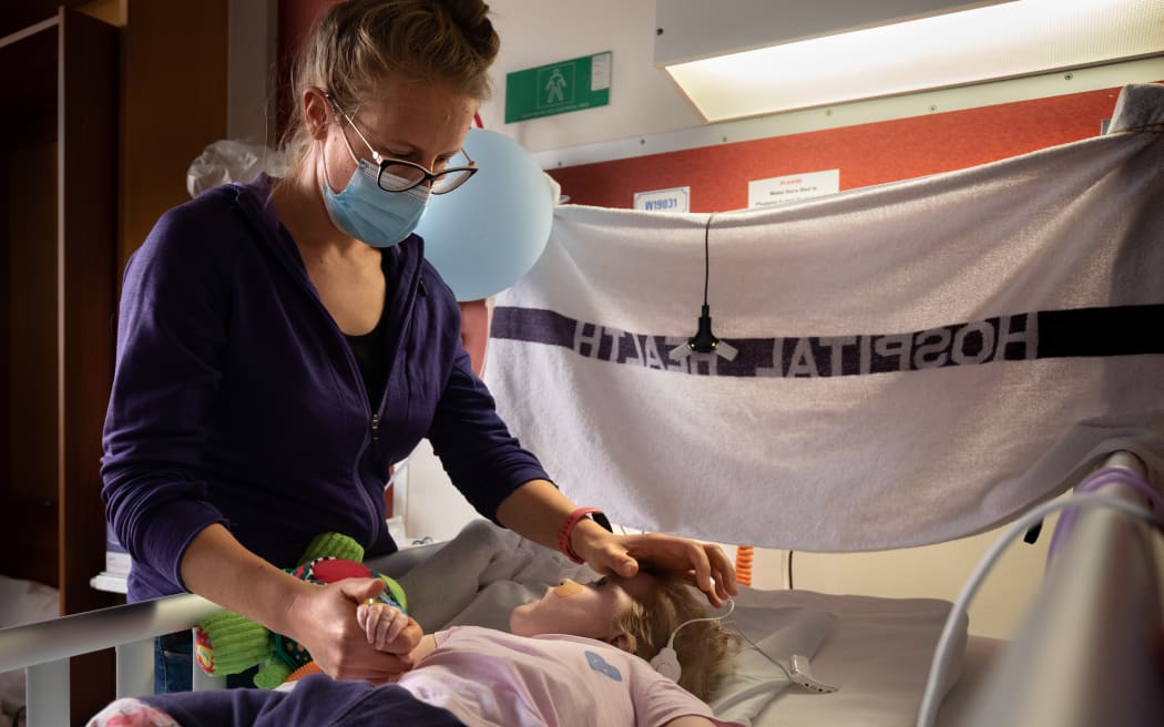 Lauren and her mother Rachel Malcolm-Swindells in her room at Wellington Regional Hospital children's ward