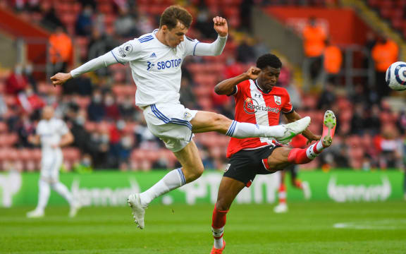 Leeds United defender Diego Llorente (14) and Southampton midfielder Nathan Tella (23) during the English championship Premier League football match between Southampton and Leeds United on May 18, 2021 at the St Mary's Stadium in Southampton, England