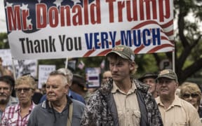 White South Africans supporting US President Donald Trump and South African and US tech billionaire Elon Musk gather in front of the US Embassy in Pretoria, on February 15, 2025 for a demonstration. Trump and Pretoria are locked in a diplomatic row over a land expropriation act that Washington says will lead to the takeover of white-owned farms.
Trump, whose tycoon ally Elon Musk was born in South Africa, said on February 7, 2025 the law signed in January would "enable the government of South Africa to seize ethnic minority Afrikaners' agricultural property without compensation".
It allows the government, as a matter of public interest, to decide on expropriations without compensation -- but only in exceptional circumstances. (Photo by MARCO LONGARI / AFP)